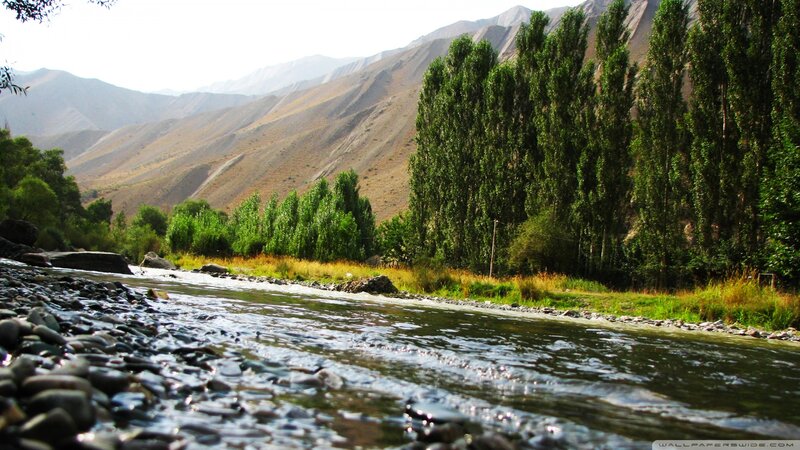 River Flowing Through Valley — Green, Serene, Afternoon, Photograph