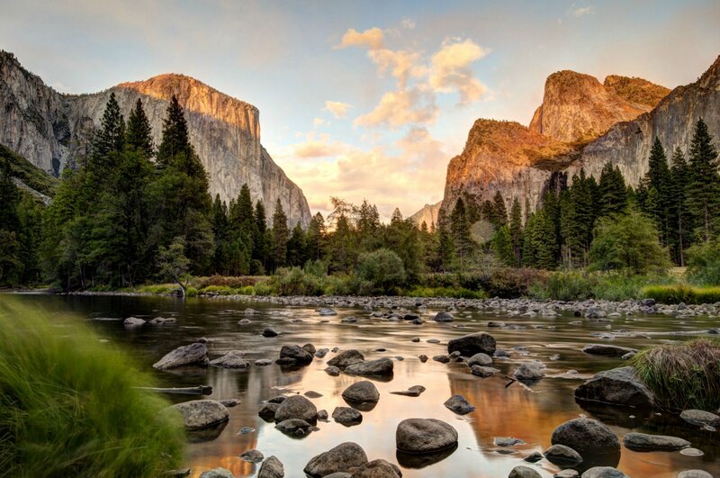 River Flowing Through Valley — Green, Serene, Sunset