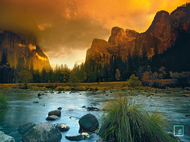 River Flowing Through Valley — Orange