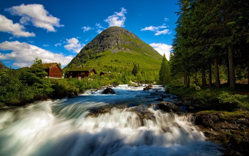 River Flowing Through Valley — Photograph