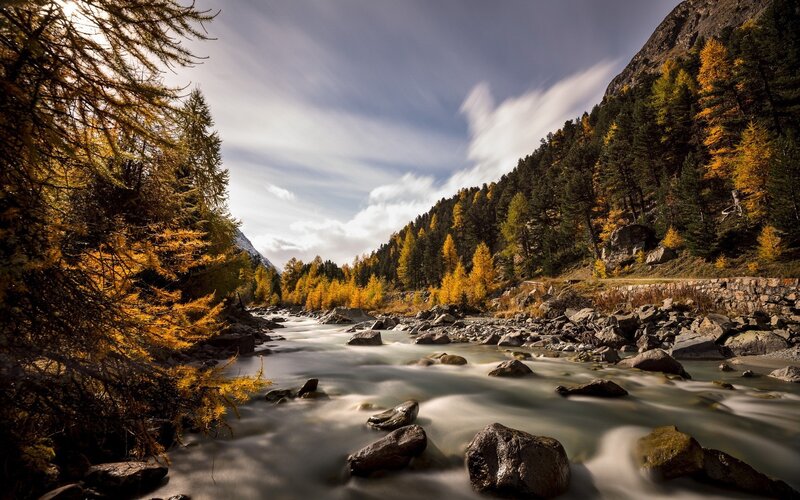 River Flowing Through Valley — Yellow