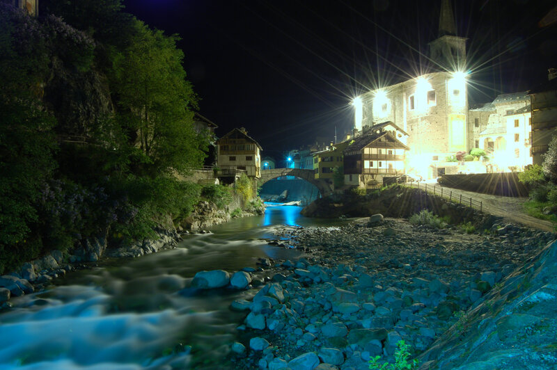 River Flowing Through Village — Blue