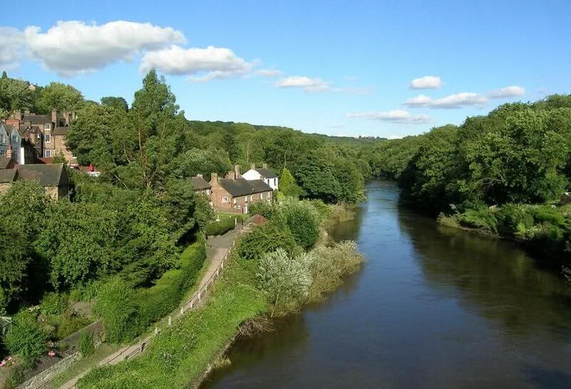 River Flowing Through Village — Green, Serene, Afternoon