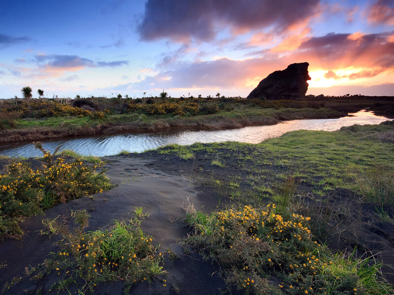 River Flowing Through Volcanic Sand