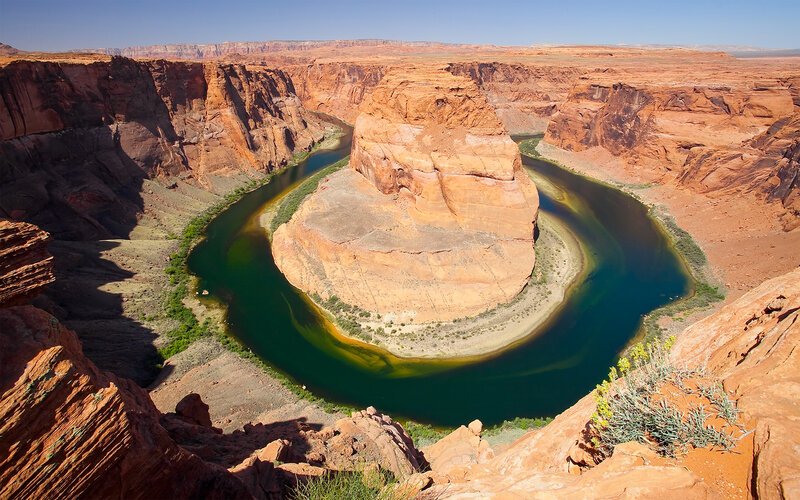 River Forming a Horseshoe Bend — Red, Dramatic, Afternoon
