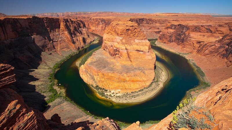 River Forming a Horseshoe Bend — Red, Dramatic