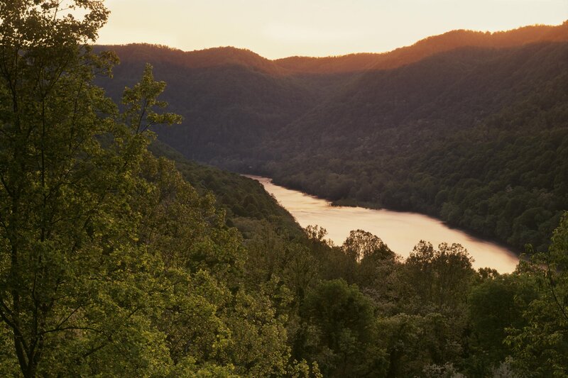 River in Forested Valley — Green, Serene, Sunset, Photograph