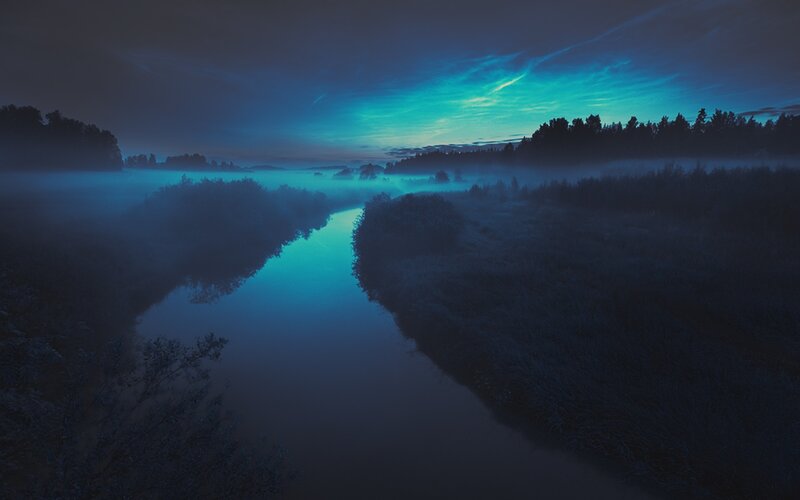 River in Misty Landscape