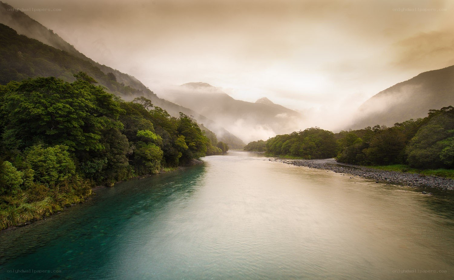 River in misty mountain valley