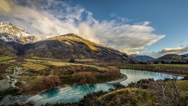 River in Mountain Valley — Blue, Dramatic, Afternoon, Photograph, Mountains, Clouds