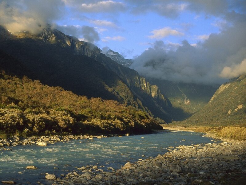 River in Mountain Valley — Blue, Dramatic, Afternoon, Photograph, Mountains, Clouds, Trees