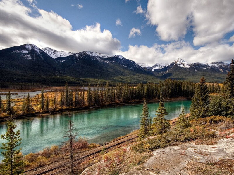 River in Mountain Valley — Blue, Serene, Afternoon, Photograph, Mountains, Forest, Train Tracks