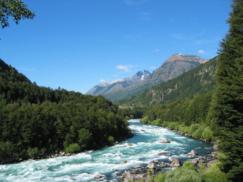 River in Mountain Valley — Blue, Serene, Afternoon, Photograph, Mountains, Trees, Rocks