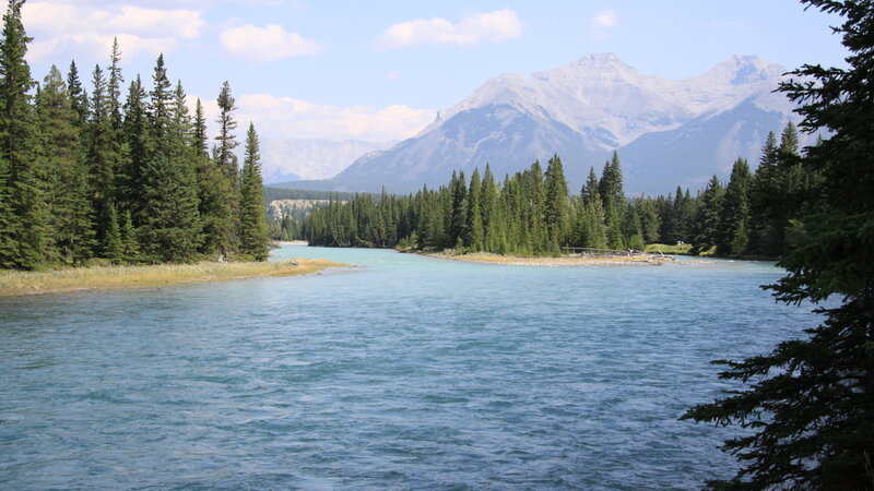 River in Mountain Valley — Blue, Serene, Afternoon, Photograph, Mountains, Trees, Sky