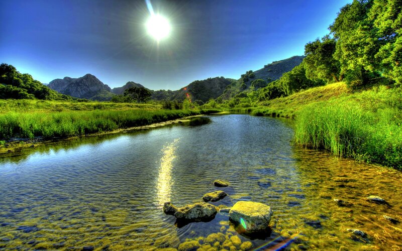 River in Mountain Valley — Blue, Serene, Afternoon, Photograph, Mountains, Trees, Sun
