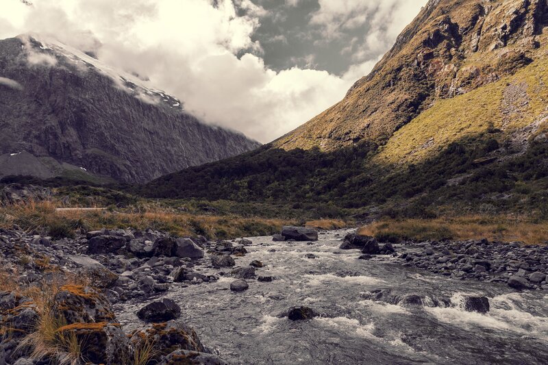 River in Mountain Valley — Gray, Dramatic, Photograph