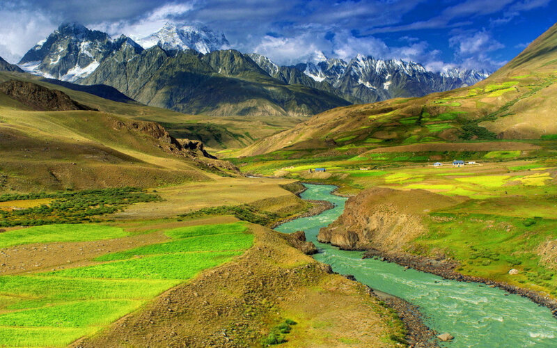 River in Mountain Valley — Green, Dramatic, Afternoon, Photograph, Mountains, Fields