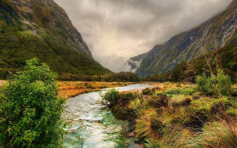 River in Mountain Valley — Green, Dramatic, Photograph, Mountains, Clouds