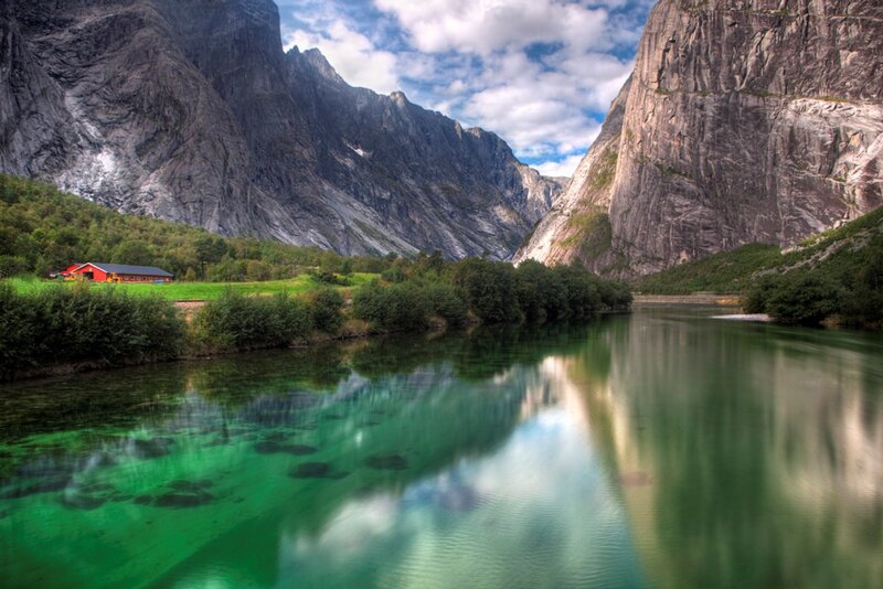 River in Mountain Valley — Green, Serene, Afternoon, Photograph, Mountains, Building
