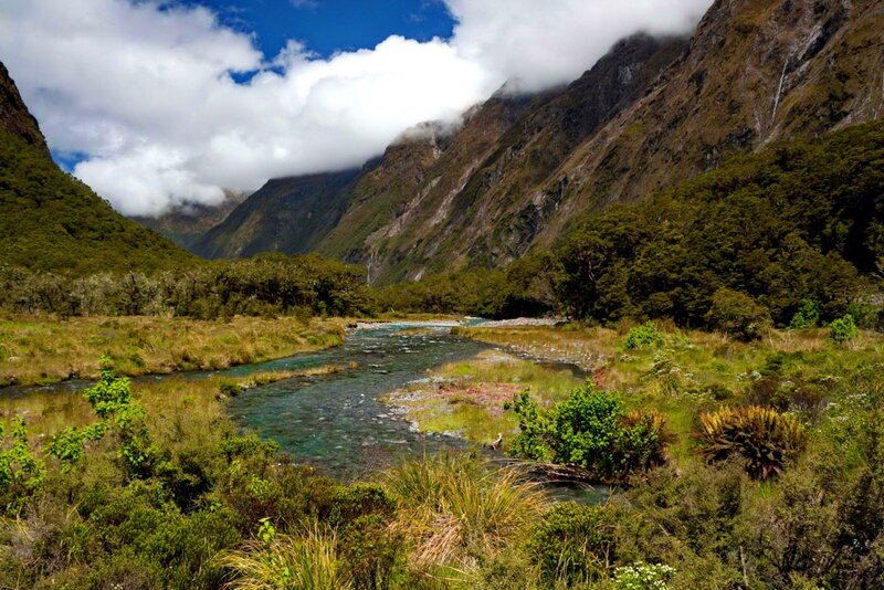 River in Mountain Valley — Green, Serene, Afternoon, Photograph, Mountains, Trees, Clouds