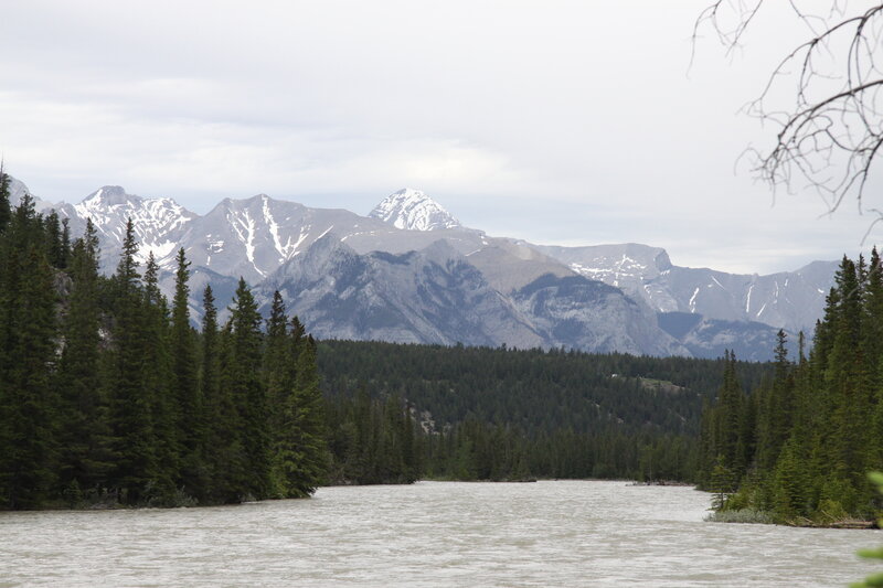 River in Mountain Valley — Green, Serene, Photograph, Mountains