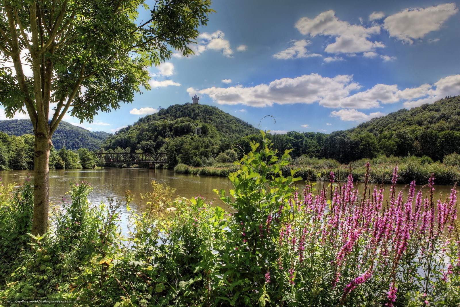 River landscape with hilltop monument