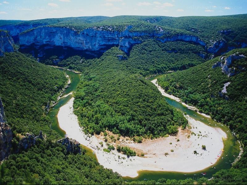 river meandering through canyon
