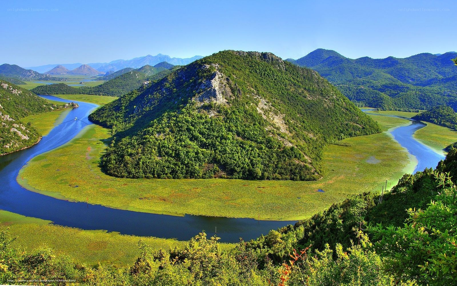 River meandering through green hills