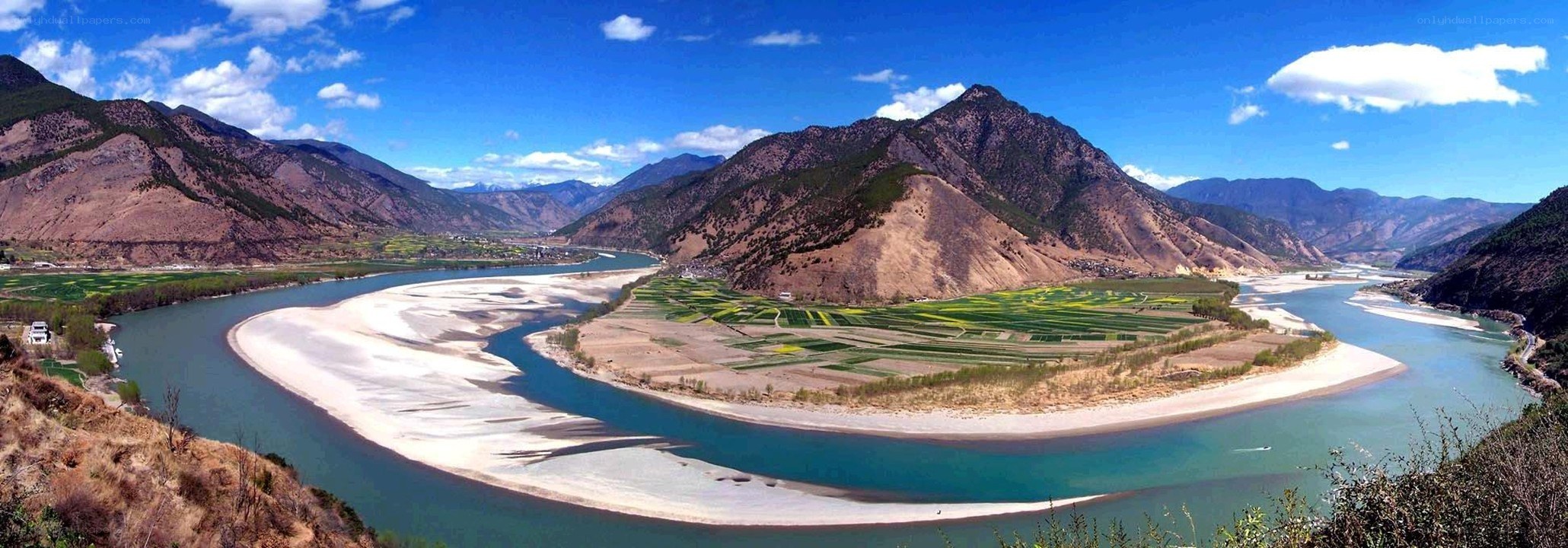 river meandering through mountains
