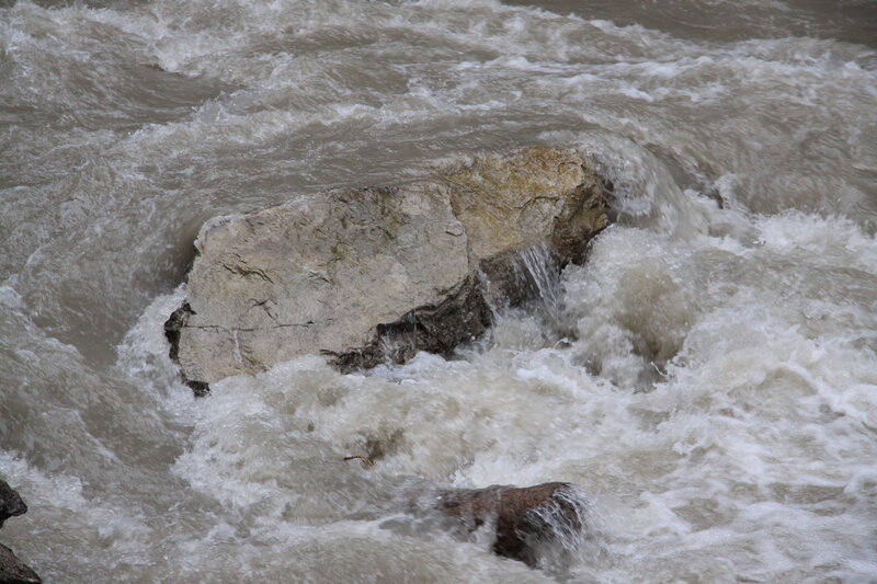 River Rapids Around Rock