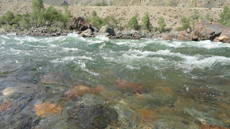 river rapids in mountain valley