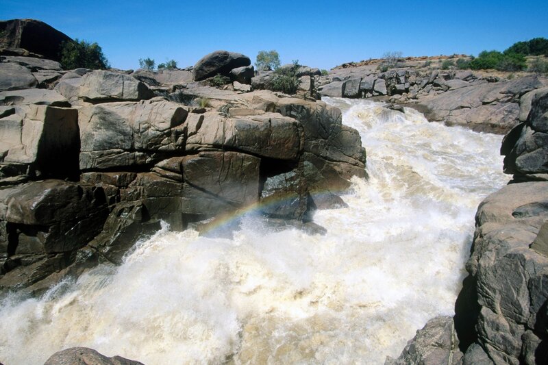 River rapids with rainbow