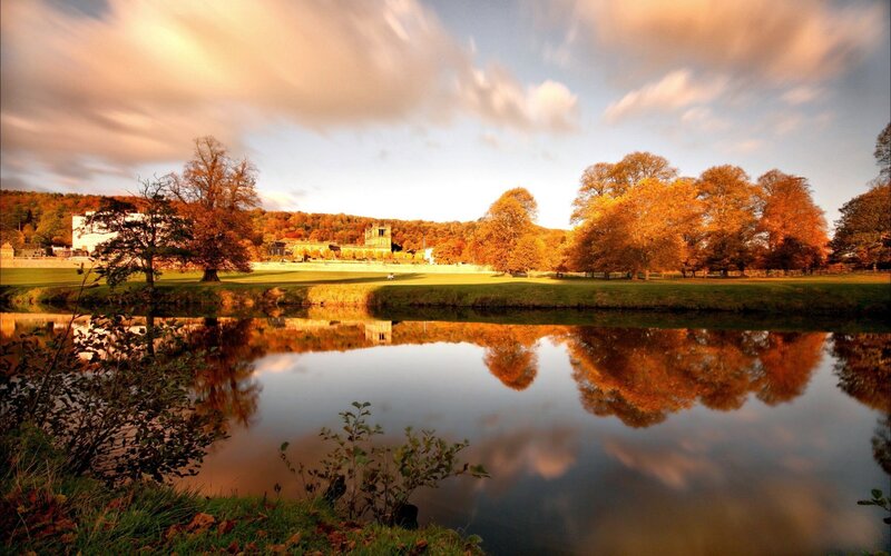 River Reflecting Autumn Trees — Orange, Serene, Photograph, Building