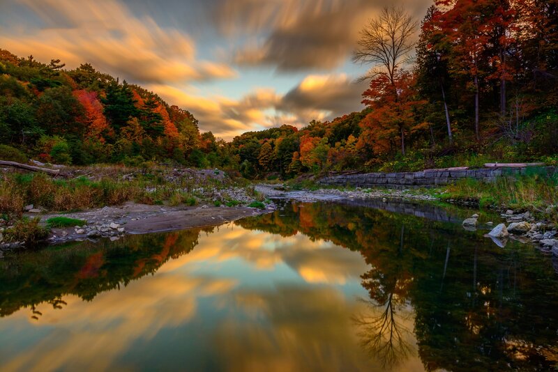 River Reflecting Autumn Trees — Orange