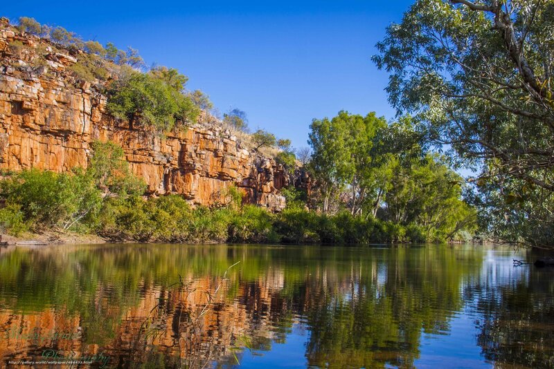 River reflecting cliffs and trees