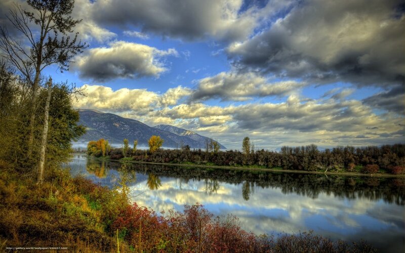 River reflecting clouds and mountains