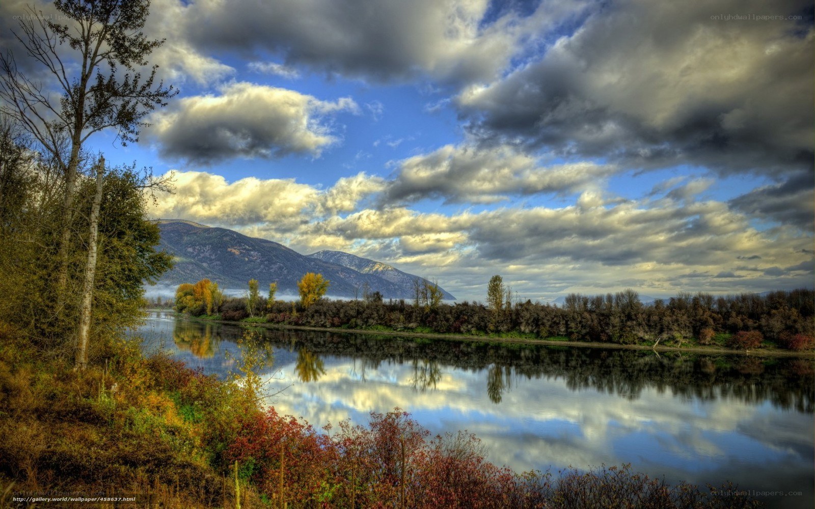 River reflecting clouds and mountains