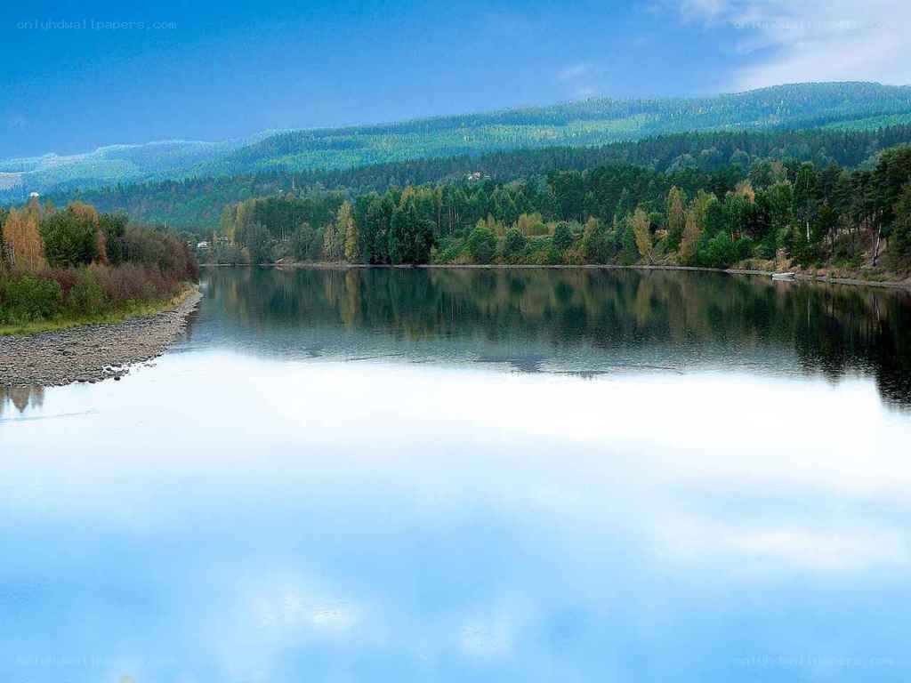 River reflecting forested hills