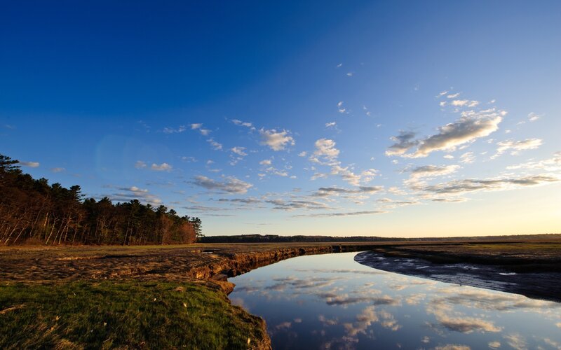 River Reflecting Sky — Blue, Serene, Sunset, Photograph, Trees, Grass