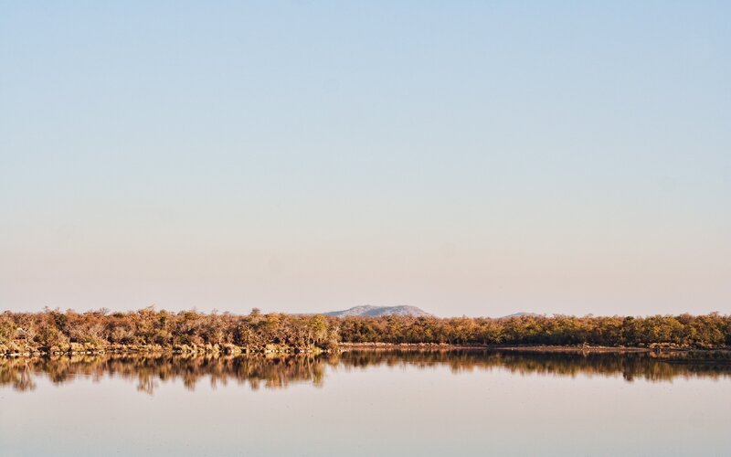 River Reflecting Trees — Blue, Serene, Sunset, Photograph, Mountain, Sky
