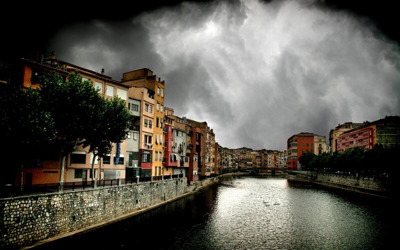 River scene under stormy sky