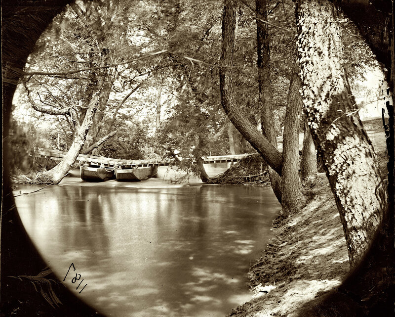 River scene with boats and bridge