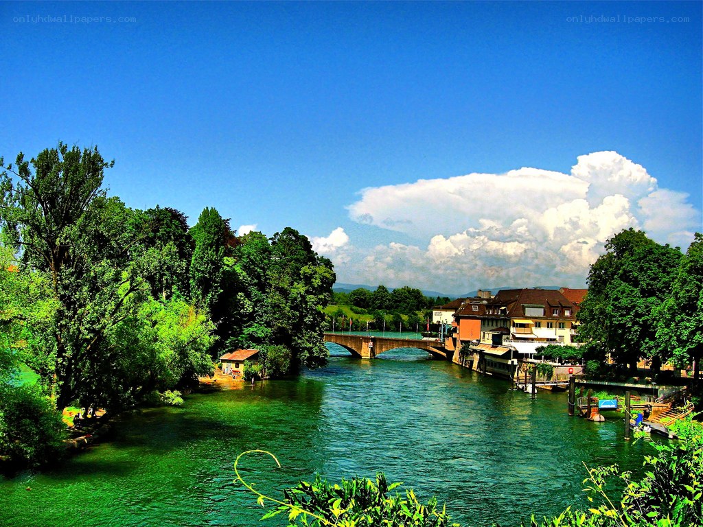 River scene with bridge and buildings
