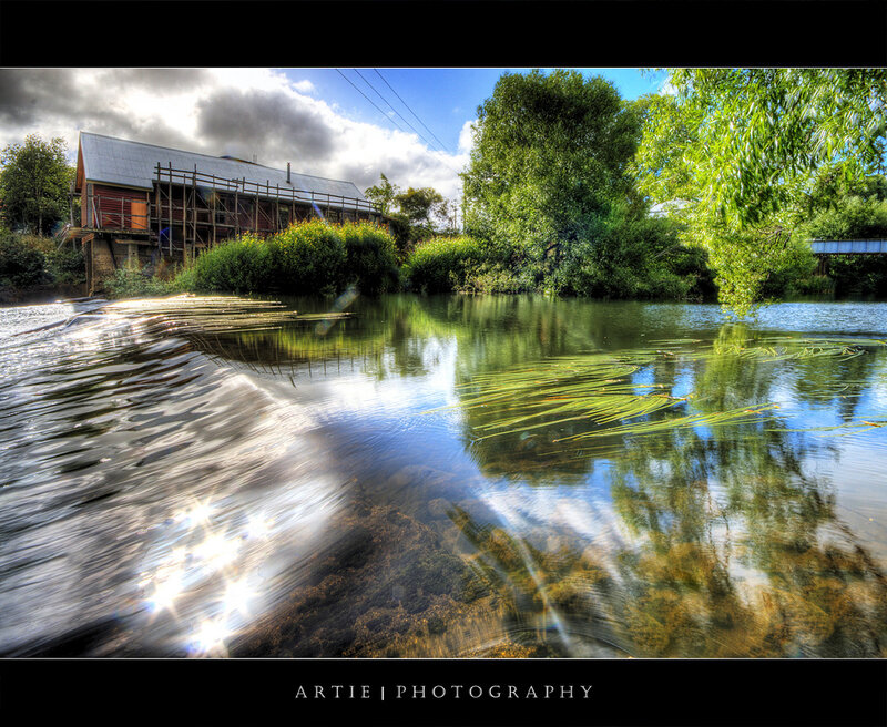 River scene with building and trees