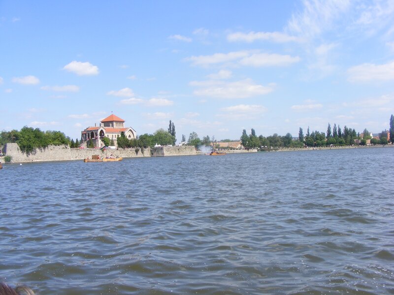 River scene with historic building