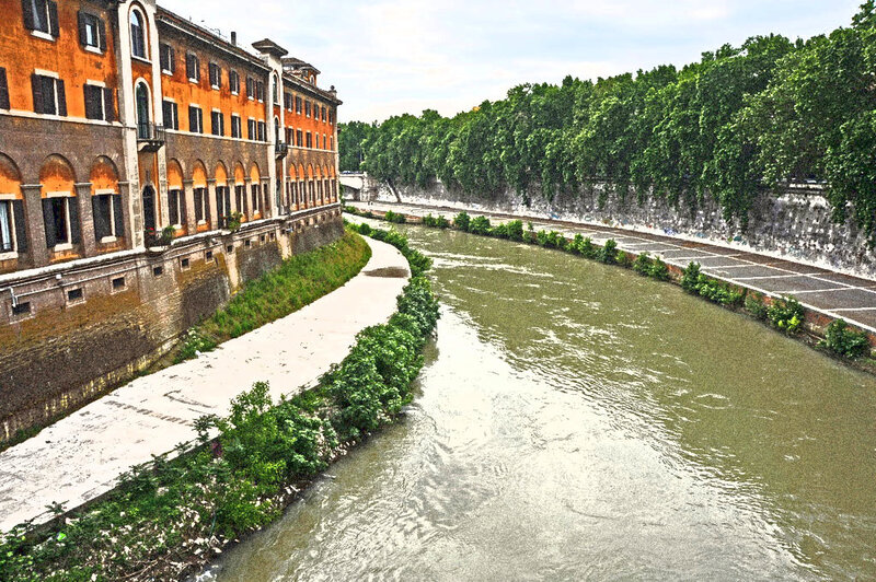 river scene with historic buildings