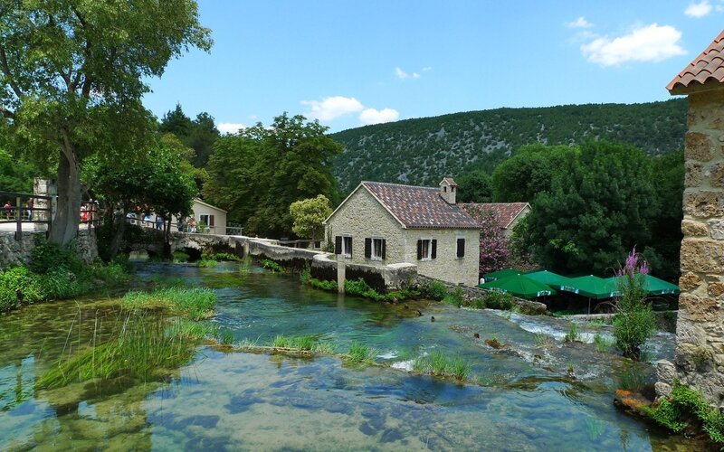 River scene with stone houses