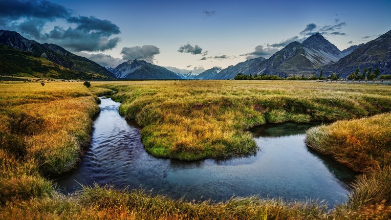 River Through Grassy Field — Blue