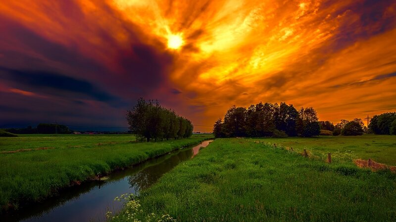 River Through Green Fields — Dramatic