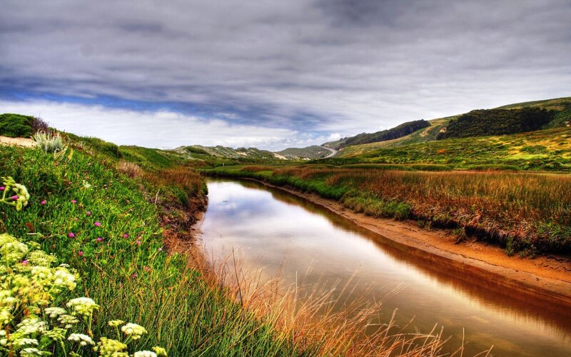River through green hills